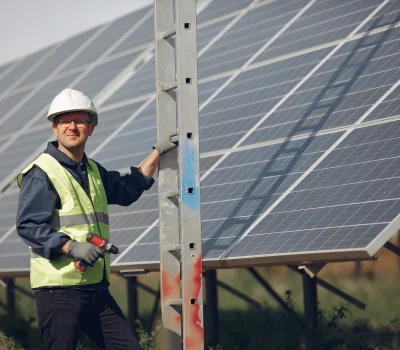 man-with-white-helmet-near-solar-panel (1)