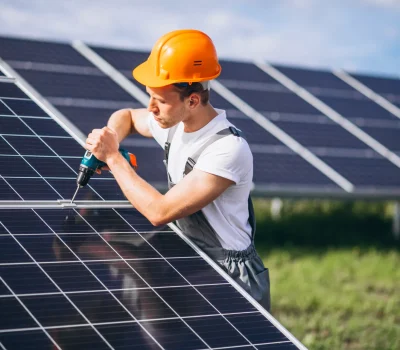man-worker-firld-by-solar-panels